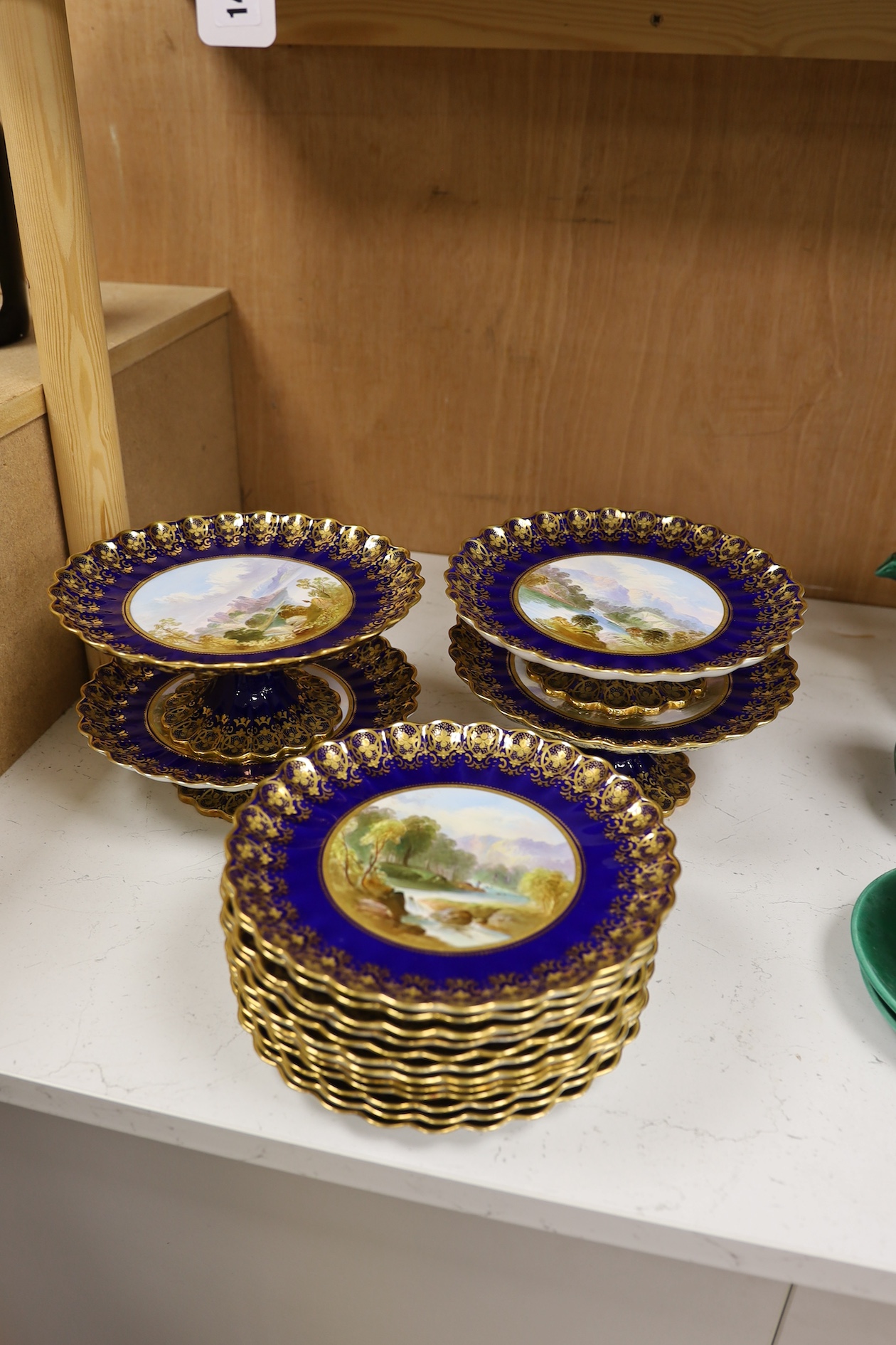 A Copeland Spode blue and gilt decorated topographical dessert service with central titled landscape cartouches, comports 21.5cm diameter. Condition - fair to good